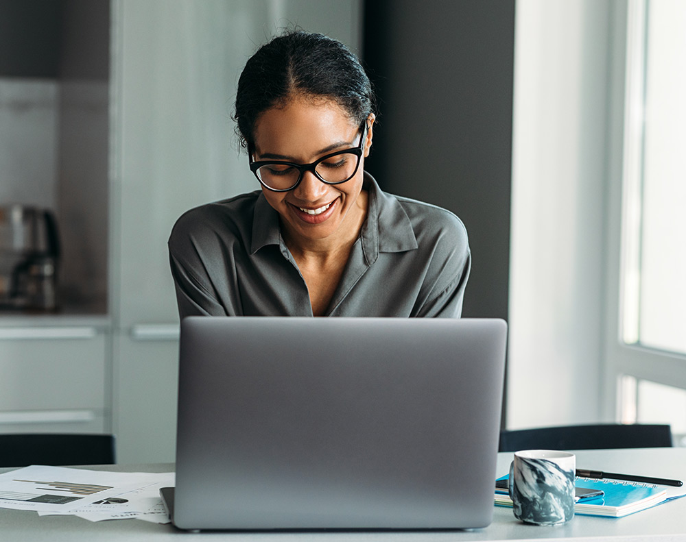 Financial Solutions | Woman using laptop