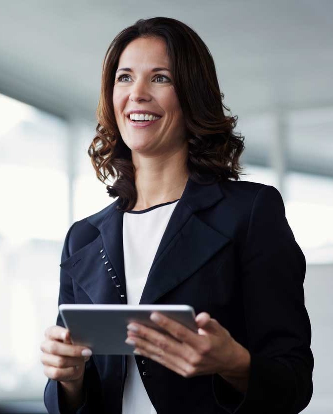 Financial Solutions | Woman standing smiling in office